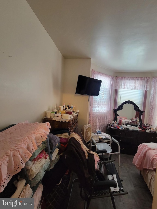 bedroom with dark parquet floors