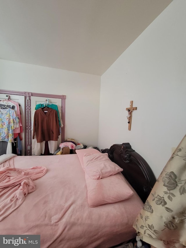 bedroom featuring vaulted ceiling