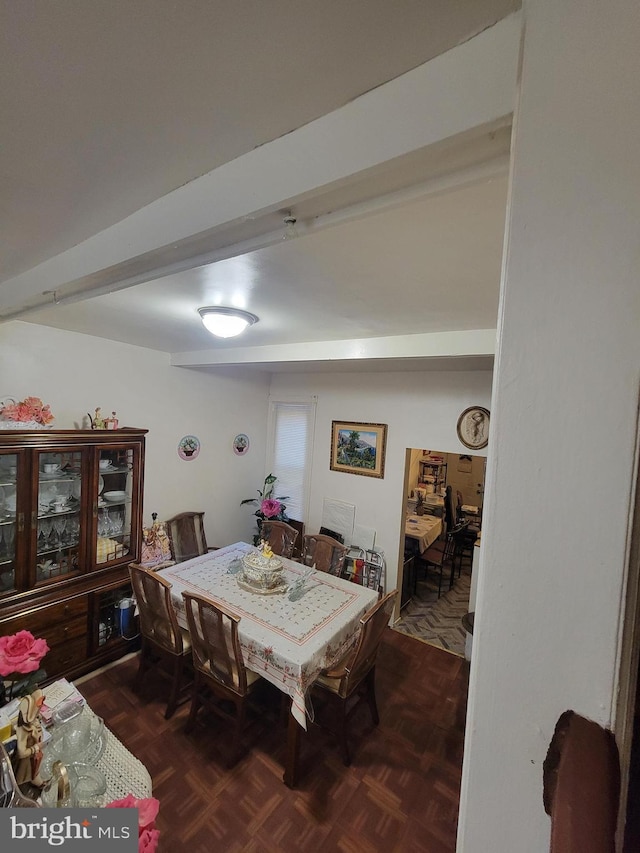 dining room with dark parquet flooring