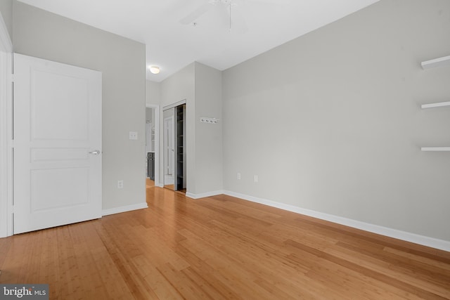 unfurnished bedroom with wood-type flooring and ceiling fan