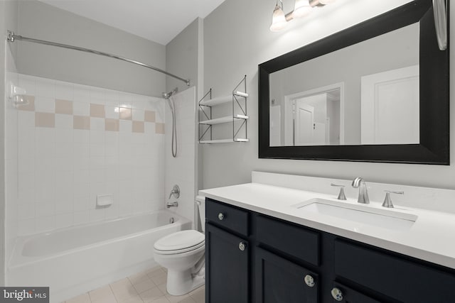 full bathroom with tile patterned flooring, vanity, toilet, and tiled shower / bath