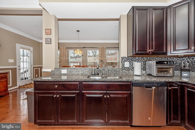 kitchen featuring light wood-type flooring, stone countertops, stainless steel dishwasher, and sink