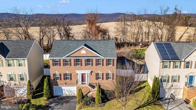 colonial home featuring a mountain view