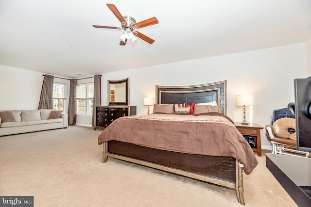 bedroom with ceiling fan and light colored carpet