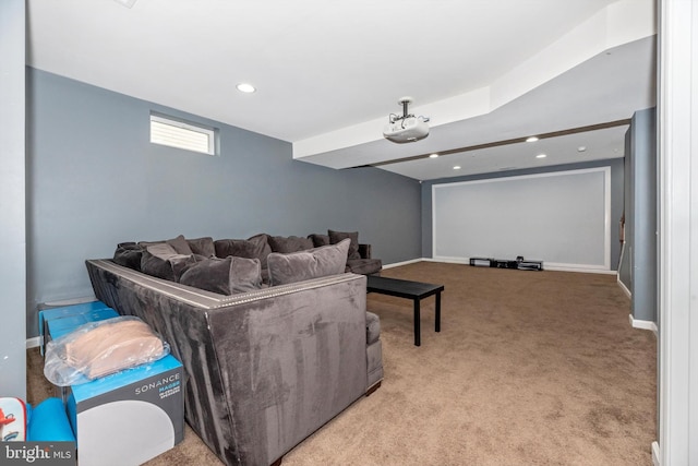 cinema room featuring light colored carpet