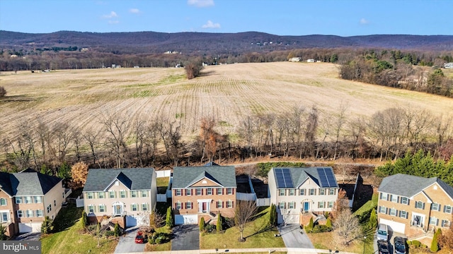 drone / aerial view featuring a mountain view