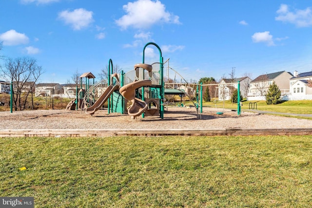 view of playground with a lawn