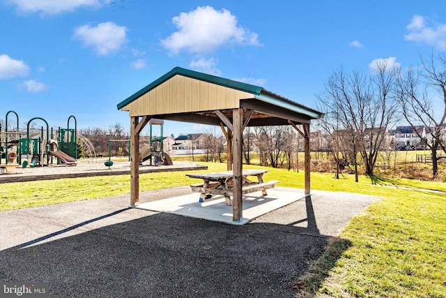 surrounding community with a lawn and a playground