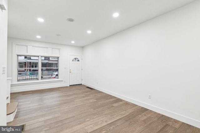 spare room featuring light hardwood / wood-style flooring