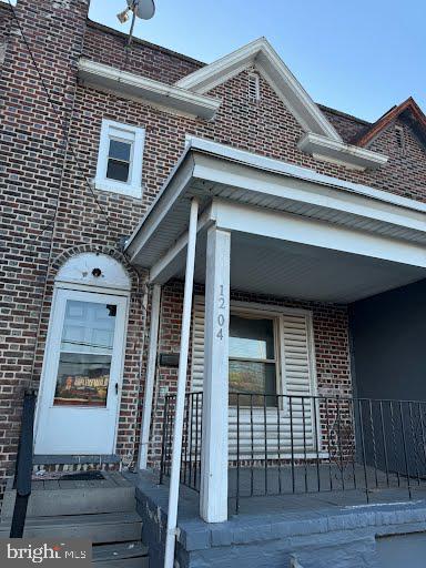 view of property exterior with a porch