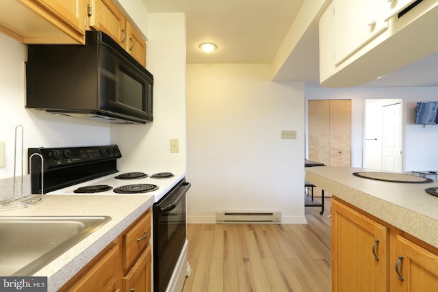 kitchen featuring baseboard heating, light hardwood / wood-style flooring, and electric range oven