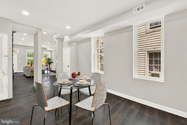 dining room with dark wood-type flooring