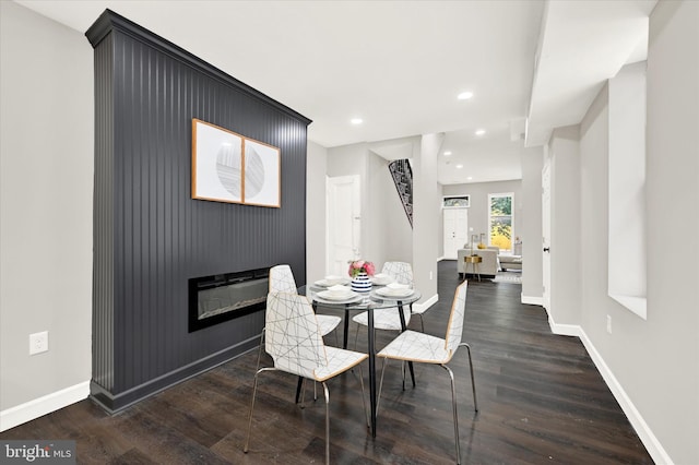 dining area featuring dark hardwood / wood-style flooring