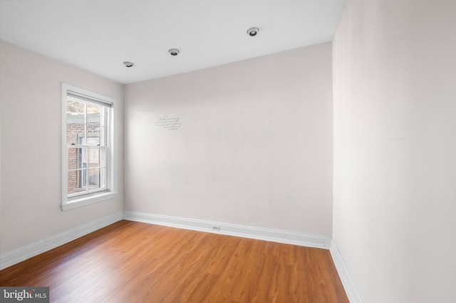 spare room featuring hardwood / wood-style floors