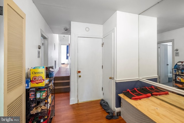 recreation room with wood-type flooring