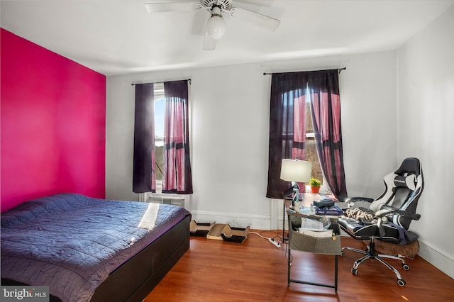 bedroom featuring hardwood / wood-style floors and ceiling fan