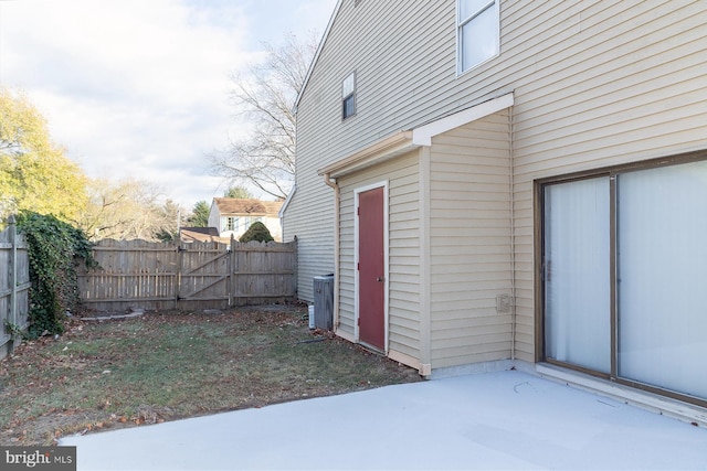 exterior space with cooling unit and a patio