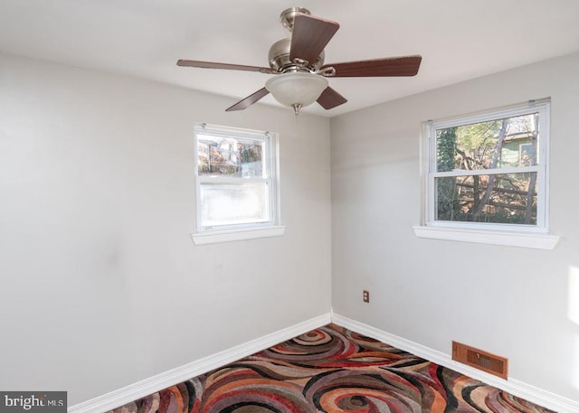 unfurnished room featuring ceiling fan