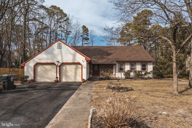 ranch-style home featuring a garage