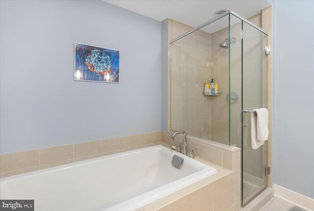 675 President St Unit 1406, Baltimore, MD 21202 - full bathroom with a garden tub and a shower stall