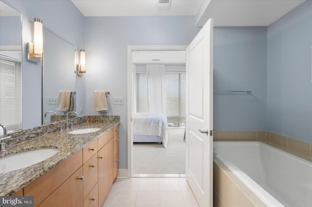 675 President St Unit 1406, Baltimore, MD 21202 - full bathroom featuring double vanity, a bath, tile patterned flooring, and connected bathroom