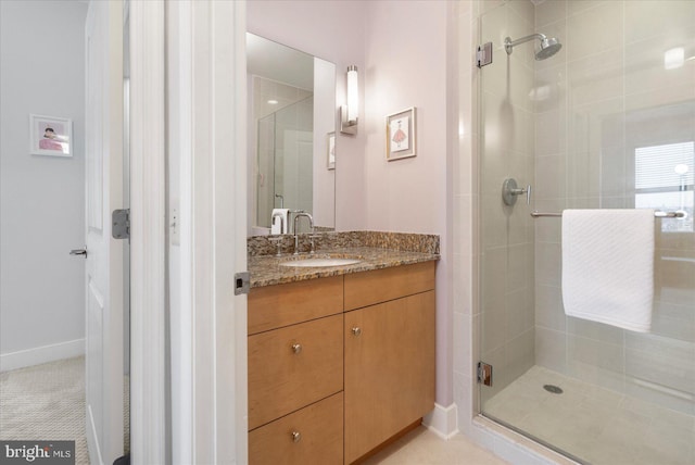 675 President St Unit 1406, Baltimore, MD 21202 - bathroom featuring a shower stall, vanity, and baseboards