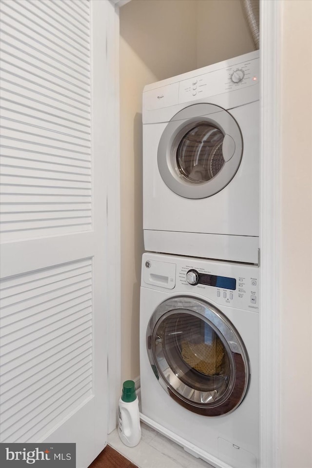 laundry room featuring stacked washer and dryer