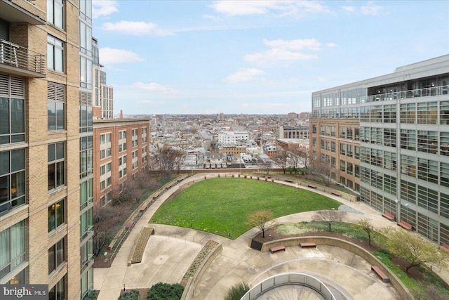 view of home's community with a yard