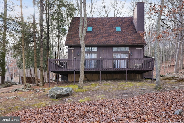 rear view of house with a deck