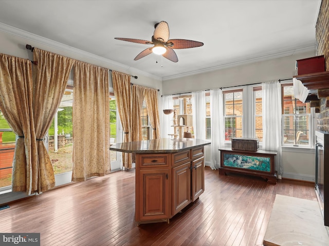 5641 Ridge Rd, Mount Airy, MD 21771 - kitchen featuring hardwood / wood-style floors, a ceiling fan, ornamental molding, dark stone countertops, and a center island
