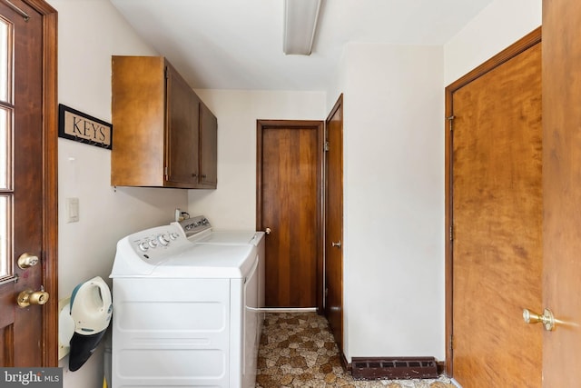 washroom with cabinets and independent washer and dryer