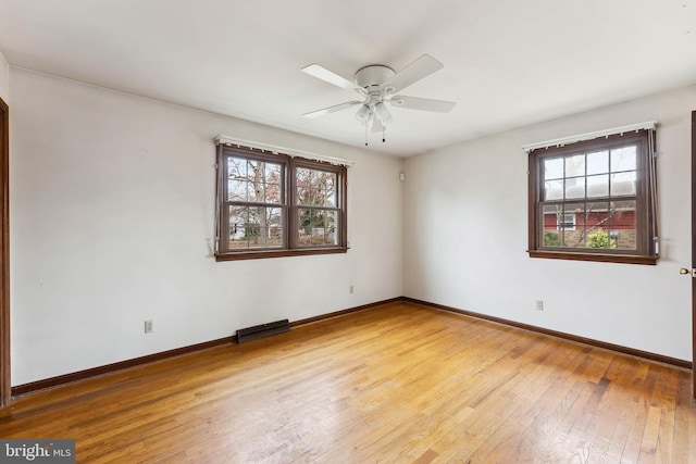 spare room with ceiling fan and light hardwood / wood-style floors