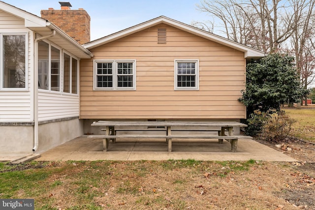 view of side of home featuring a patio