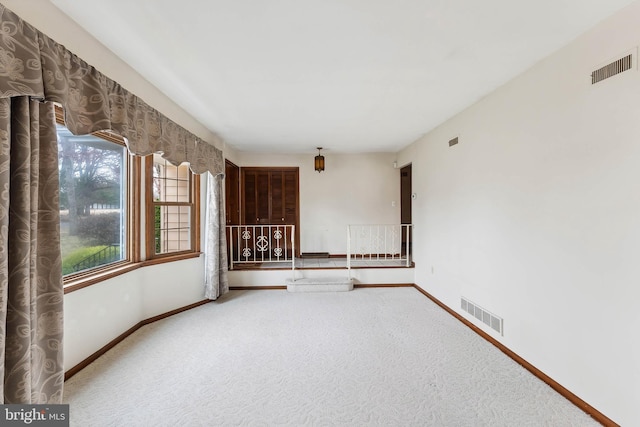 empty room with carpet flooring