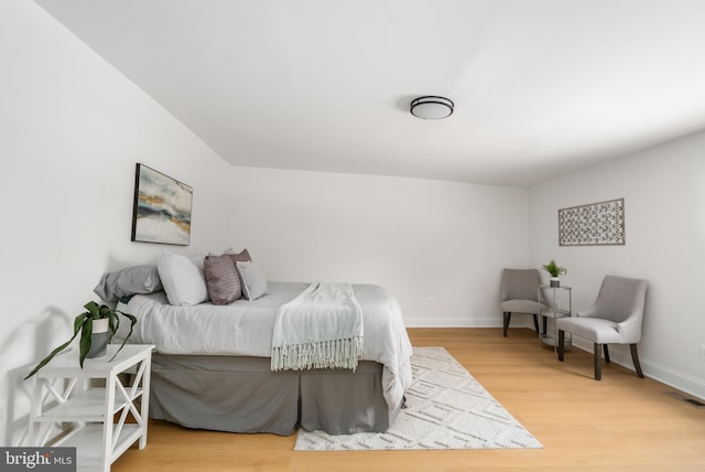 bedroom with hardwood / wood-style floors