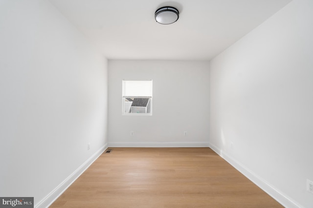 unfurnished room with light hardwood / wood-style flooring