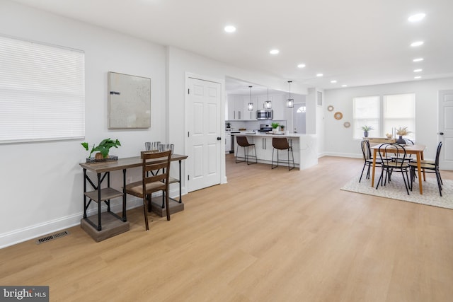 dining area featuring light hardwood / wood-style flooring