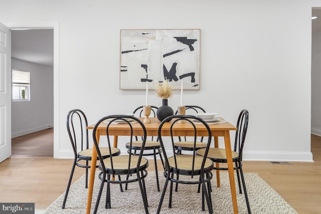 dining room with light hardwood / wood-style flooring