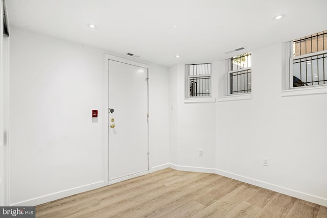 unfurnished room featuring light hardwood / wood-style flooring