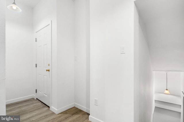 hall with light wood-type flooring