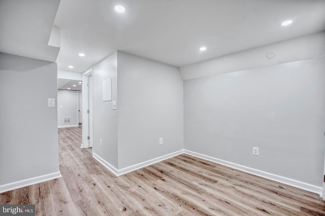 spare room with light wood-type flooring