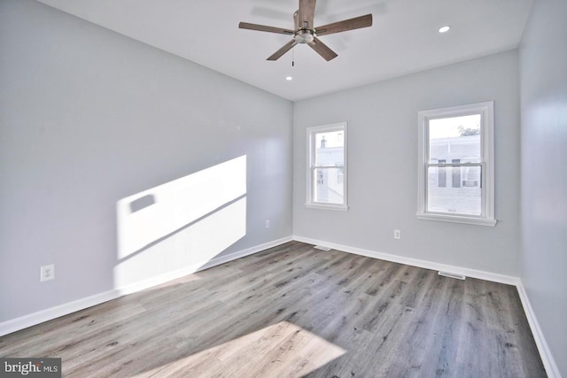 spare room with ceiling fan and light hardwood / wood-style flooring