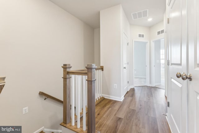 corridor featuring light hardwood / wood-style floors