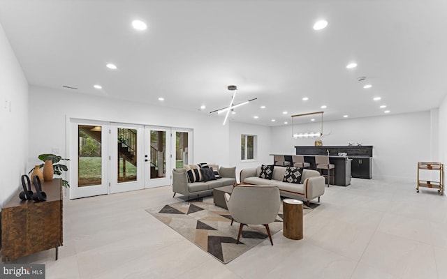 tiled living room with french doors and indoor bar