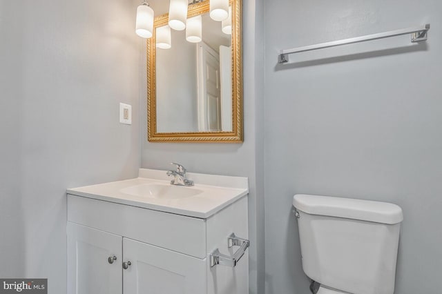 bathroom with toilet and vanity