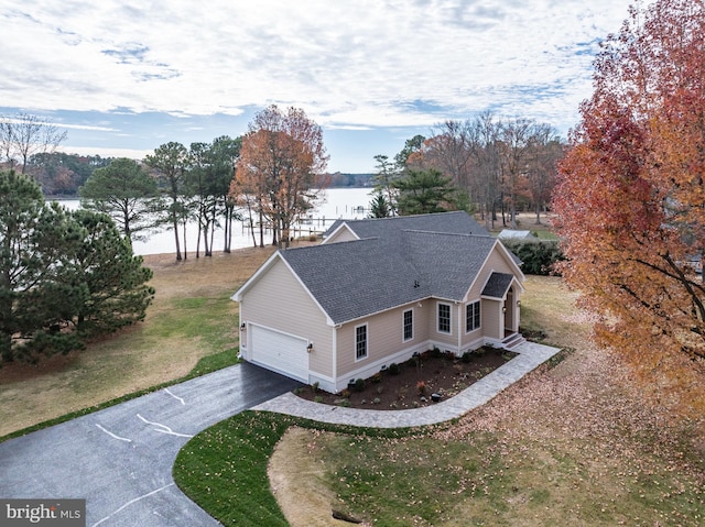 drone / aerial view with a water view