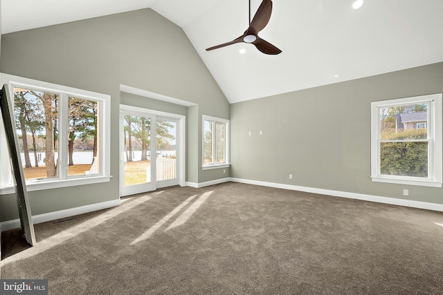 unfurnished living room with carpet floors, plenty of natural light, and ceiling fan