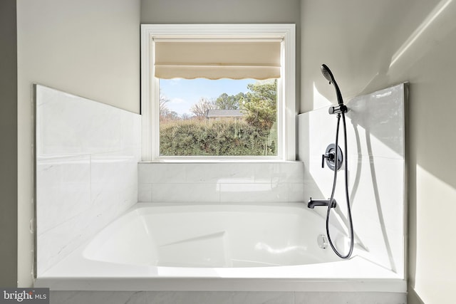 bathroom featuring tiled bath