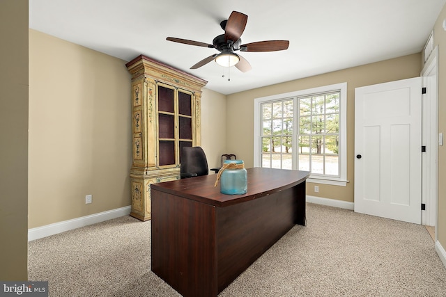 carpeted office with ceiling fan