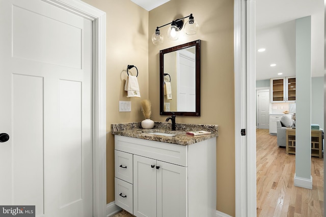 bathroom featuring hardwood / wood-style floors and vanity